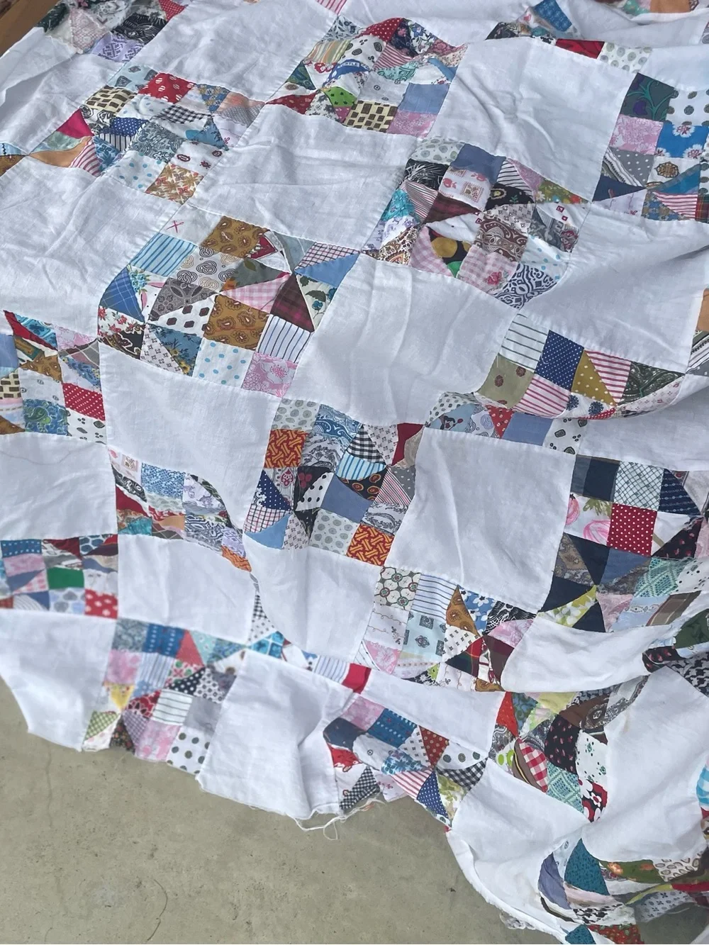 Handmade Hand stitched  White Patchwork Quilt with Multicolored Squares.